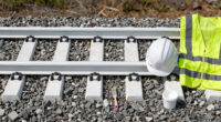 Painting The Sides Of Railroad Rails White To Reduce Derailment